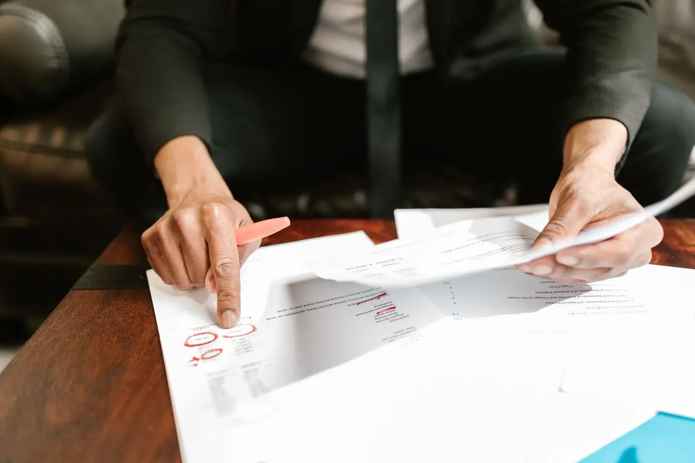 Advisor reviewing printed tax documents with a client