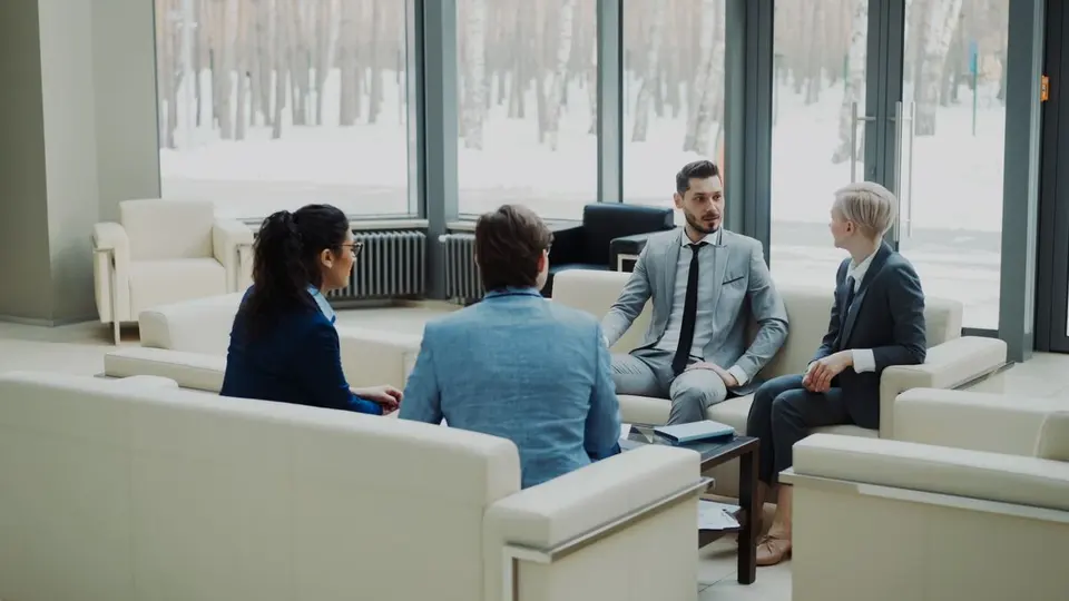Business professionals meeting in a bright lounge